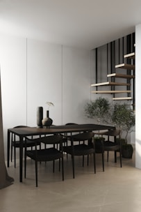 A modern dining area featuring a sleek table and chairs.