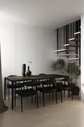A dining area showcasing a minimalist dining table with elegant chairs.