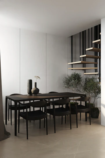 Modern dining area featuring sleek chairs and a minimalist table
