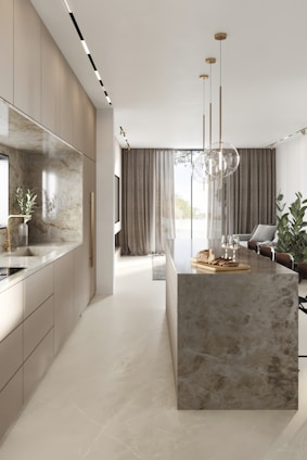 A sleek modern kitchen interior with elegant lighting and high-end finishes.