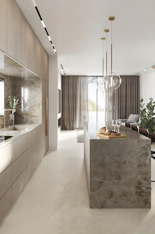 A luxury home kitchen featuring metallic finishes, crisp parchment walls, and subtle lighting.