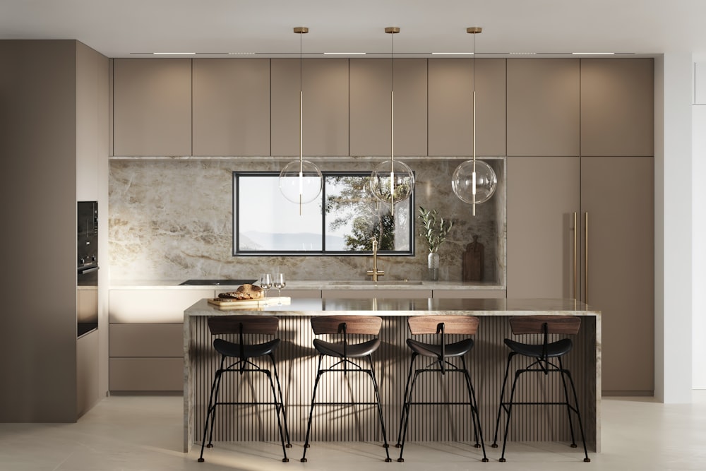 a kitchen with a center island and bar stools