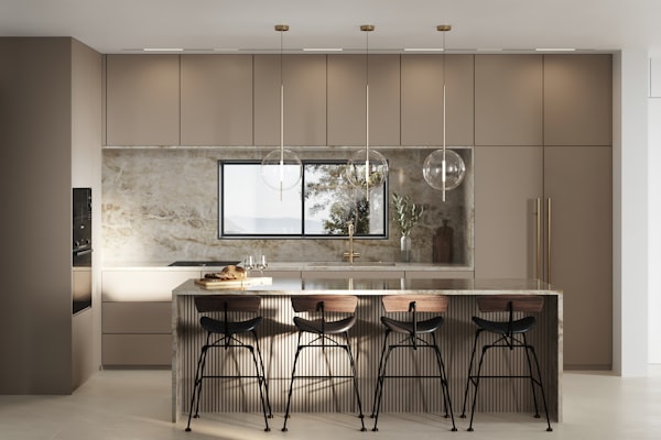 warm colored kitchen - breakfast counter kitchen - kitchen island - elegant modern lighting