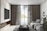 A sleek living room with a large flat-screen TV mounted above a fireplace, wires completely hidden.