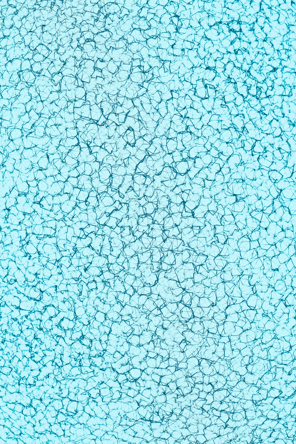 a blue background with small cracks in it