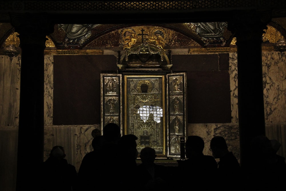 a group of people standing in front of a doorway