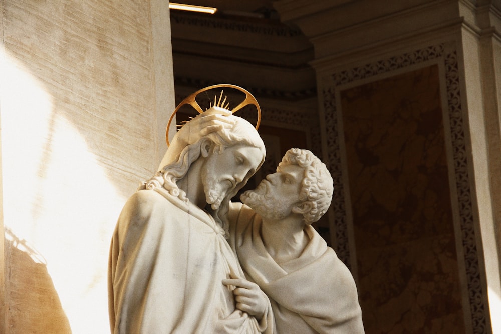 a statue of a man and a woman with a star on their head