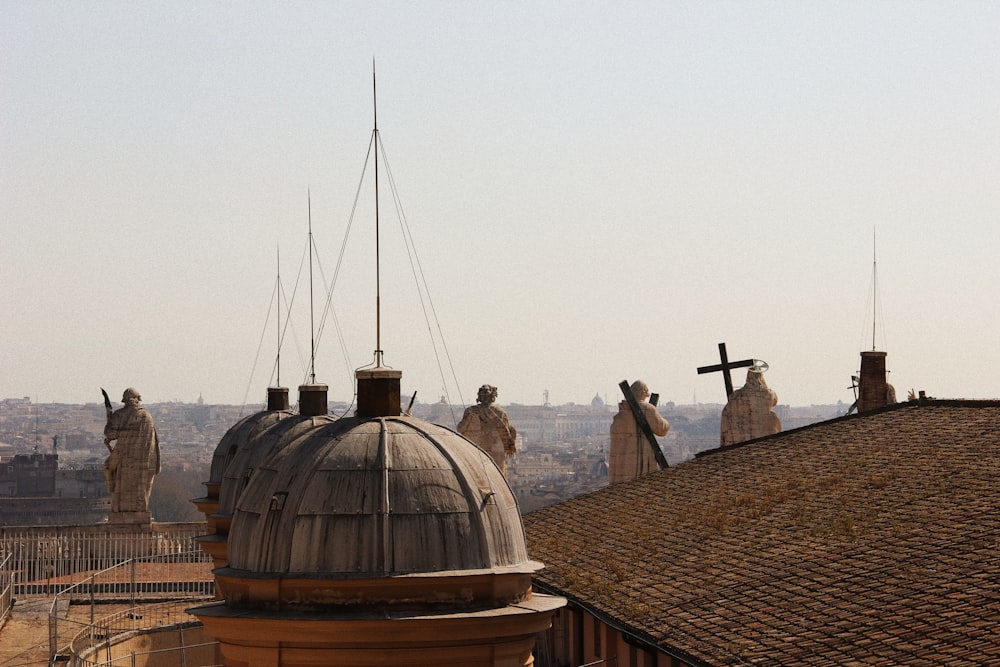 a group of statues on top of a building