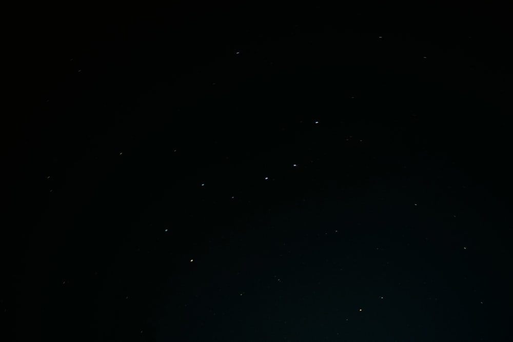 a dark sky with a few stars in it