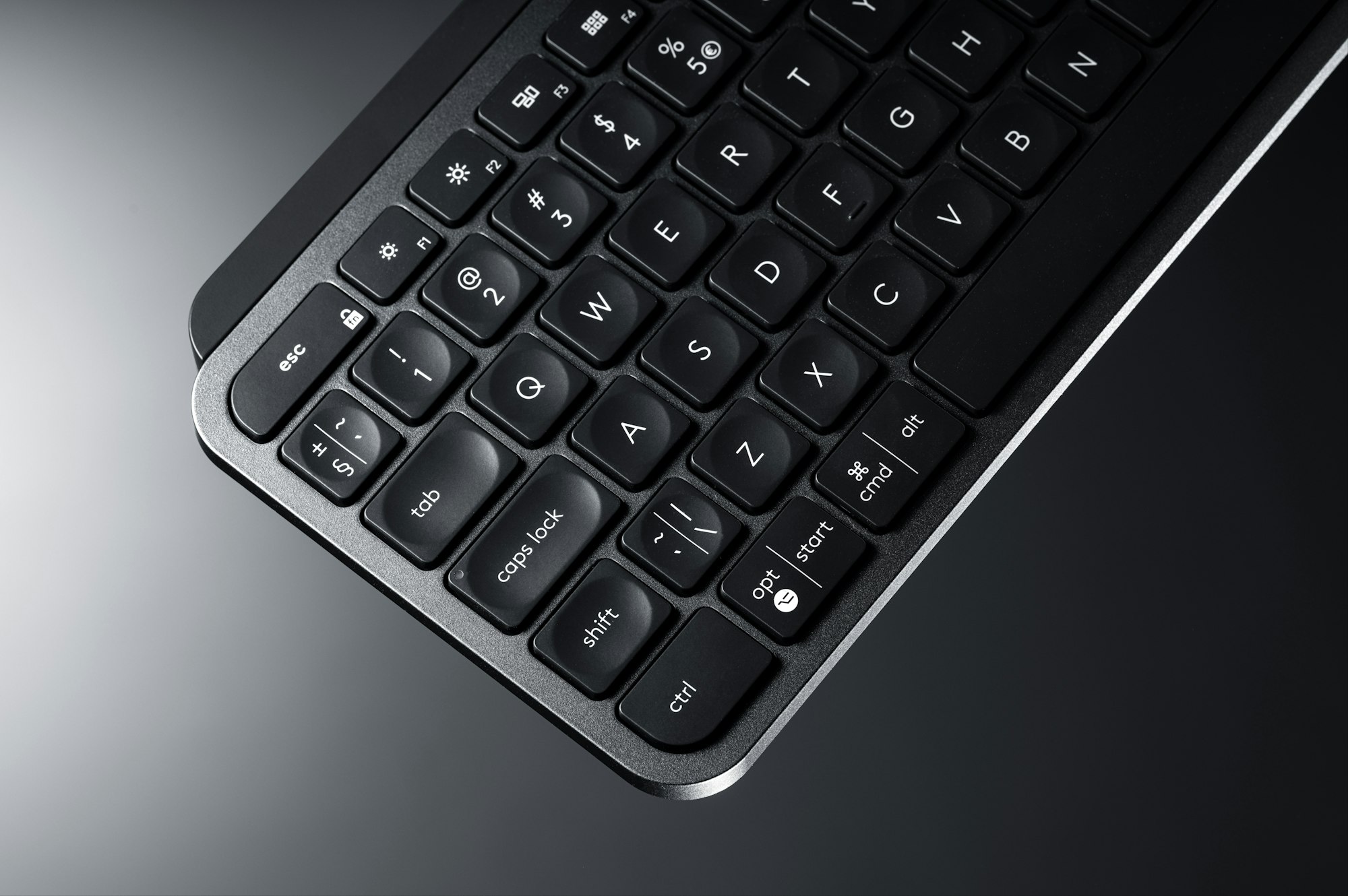 a close up of a black keyboard on a table