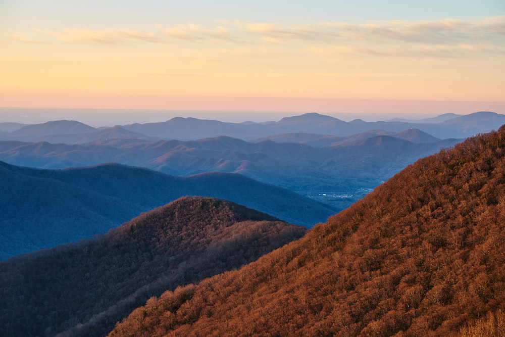 a view of a mountain range at sunset