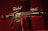 A black rifle with various attachments, including a scope and other tactical gear, is set against a dark, red-tinged background. The lighting emphasizes the structure of the weapon, casting shadows and highlighting its details.