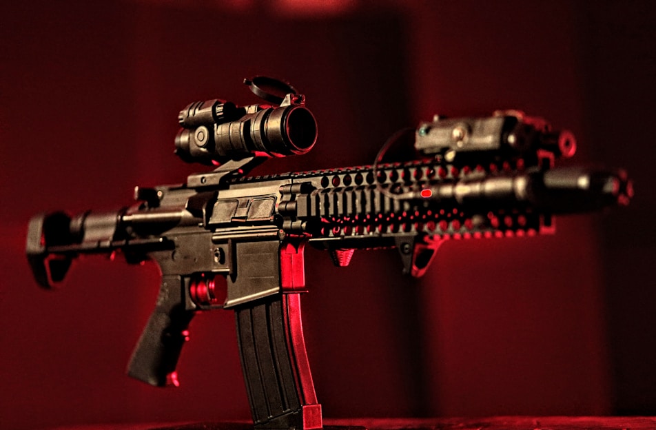 A high-quality AR-15 rifle displayed in a tactical setting.