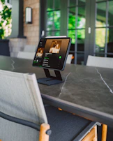 A tablet screen showing the Ototo playlist on Spotify during a car ride.