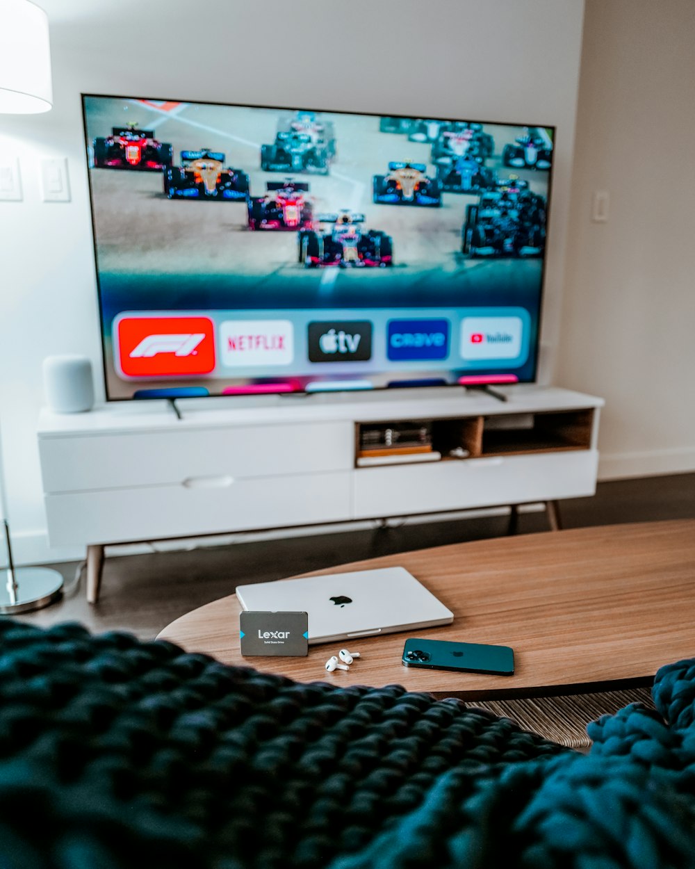 a flat screen tv sitting on top of a wooden table