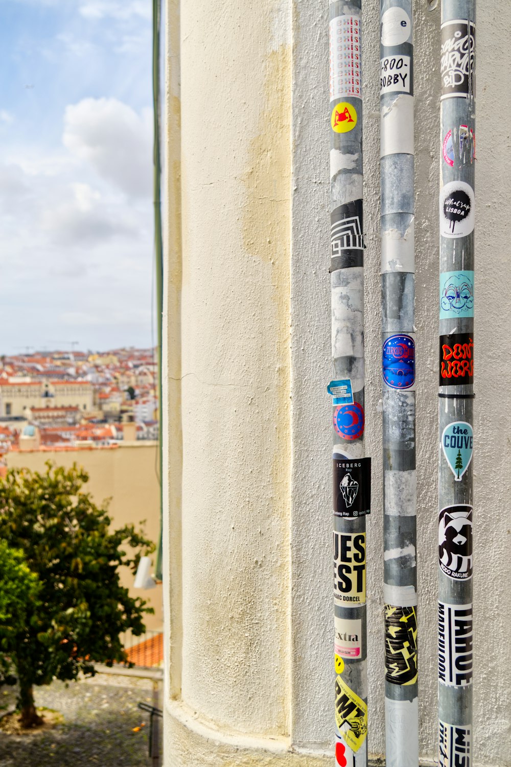 a bunch of stickers that are on the side of a building