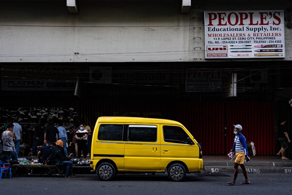 a yellow van parked on the side of a road