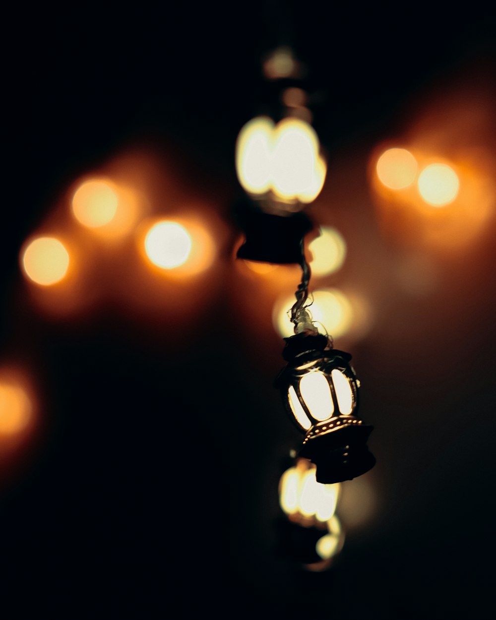 a string of lights hanging from a ceiling