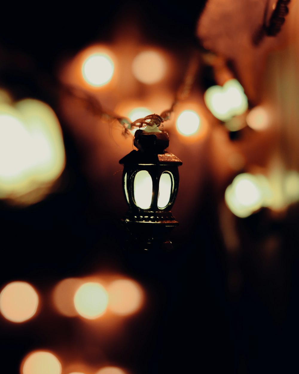 a small lantern is lit up in the dark
