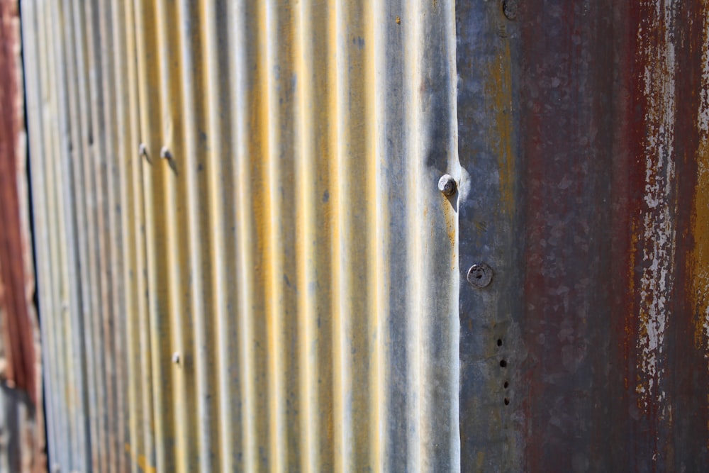 a close up of a rusted metal wall