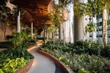 A high-end condominium garden featuring elegant pathways and ambient lighting.
