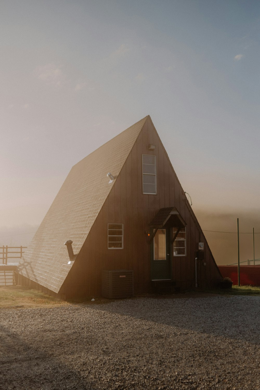 a large triangular shaped building with a door