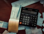 a calculator sitting on top of a wooden table
