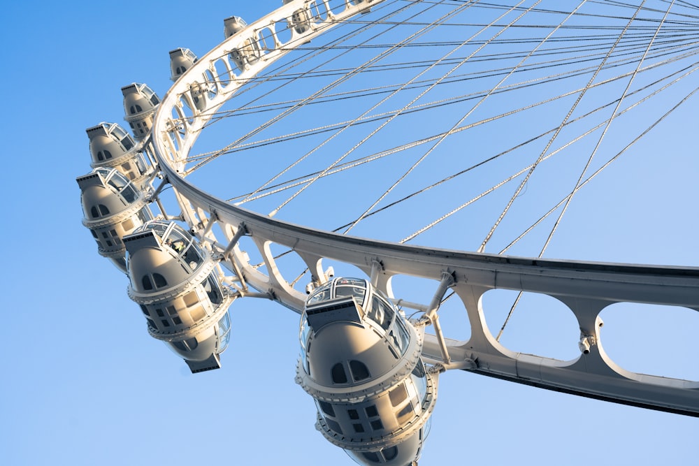 a large white ferris wheel against a blue sky