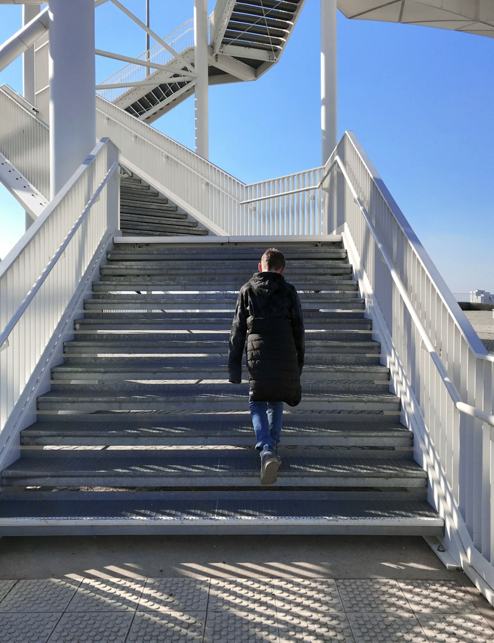 a person walking up a flight of stairs