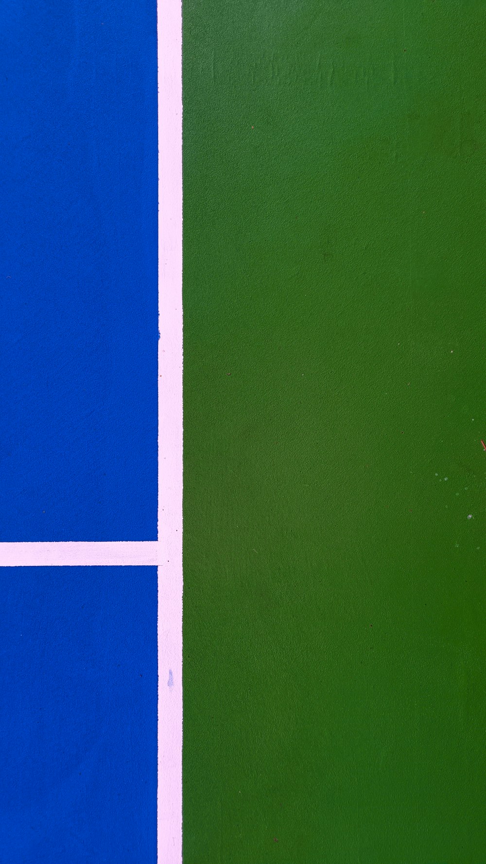 a tennis player swinging a racket on a court