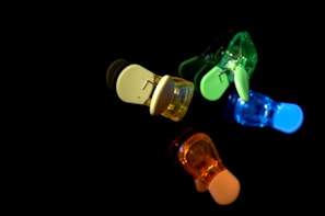 Sample products crafted from various filament colors, arranged to show contrast and vibrancy under natural light.