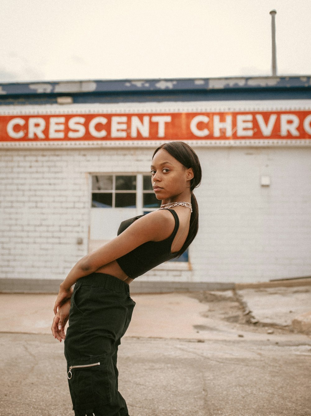 a woman standing in front of a building