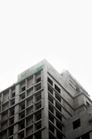 A wide shot of a partially built structure showcasing concrete and steel framework.