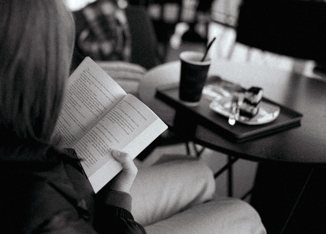 A caregiver taking a relaxing break, perhaps reading a book or enjoying a cup of tea - Alzheimer patient care A caregiver taking a relaxing break, perhaps reading a book or enjoying a cup of tea - Alzheimer patient care