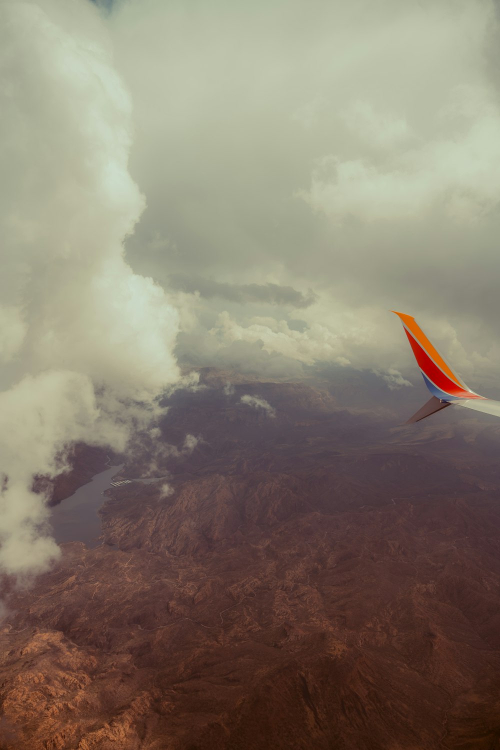 a view of the wing of an airplane in the sky