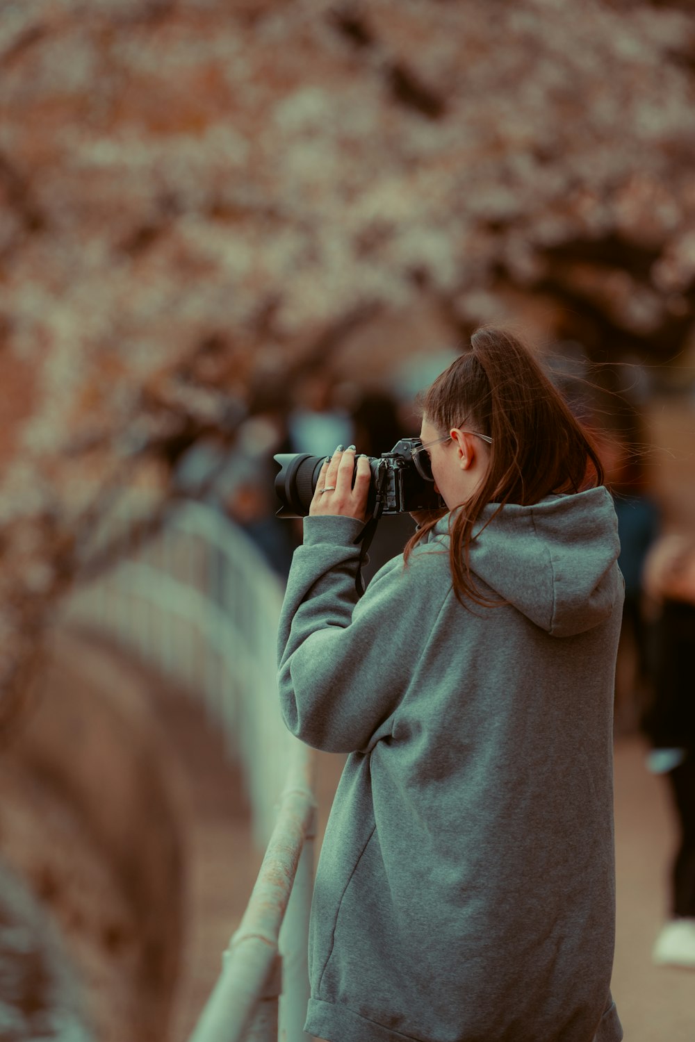 a woman taking a picture with a camera