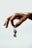 a person holding a small key in their hand