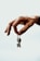 a person holding a small key in their hand