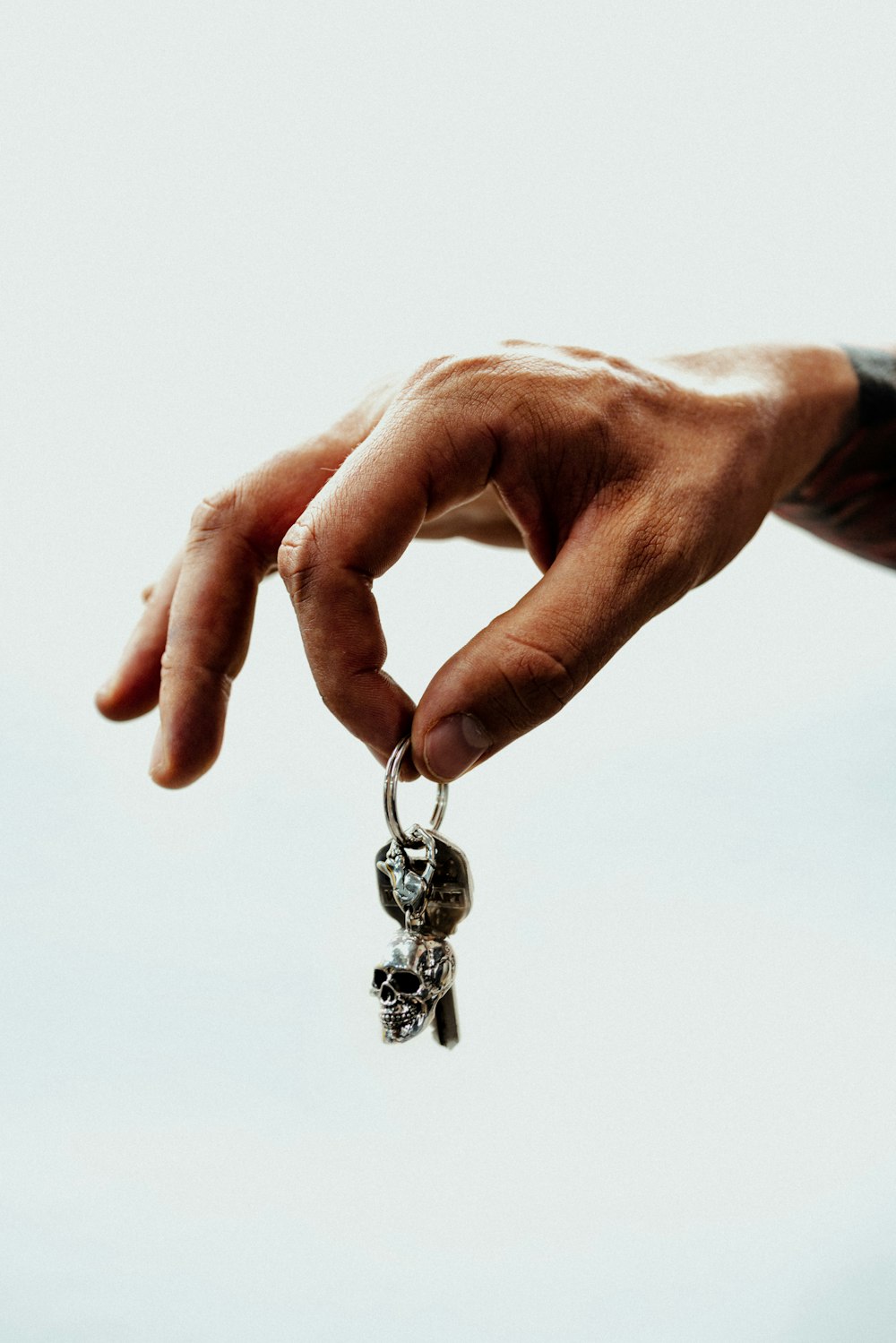 a person holding a small key in their hand