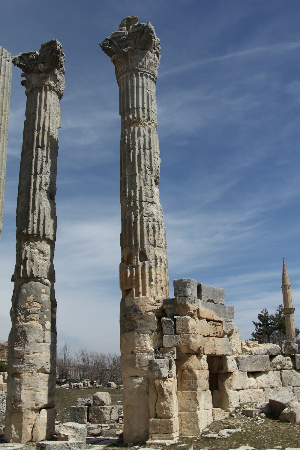 a couple of tall stone pillars sitting next to each other