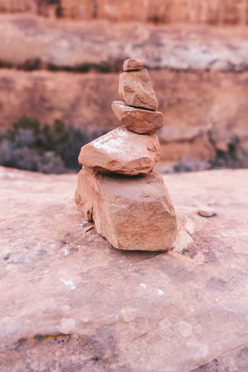 a stack of rocks sitting on top of a rock