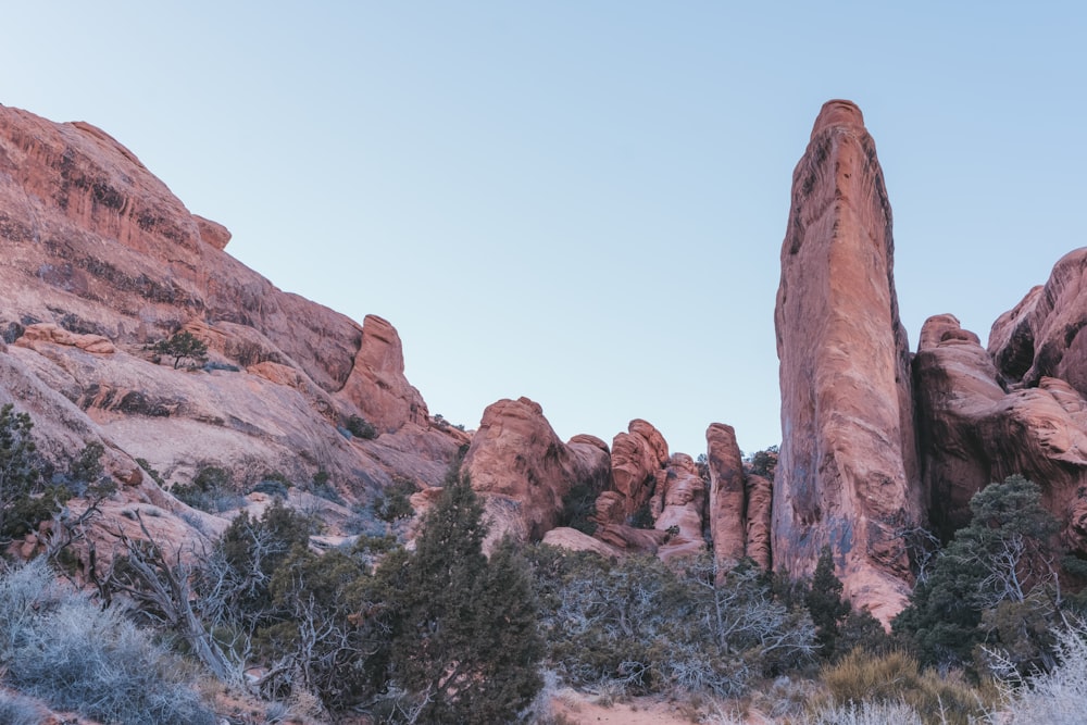 a large rock formation in the middle of a desert