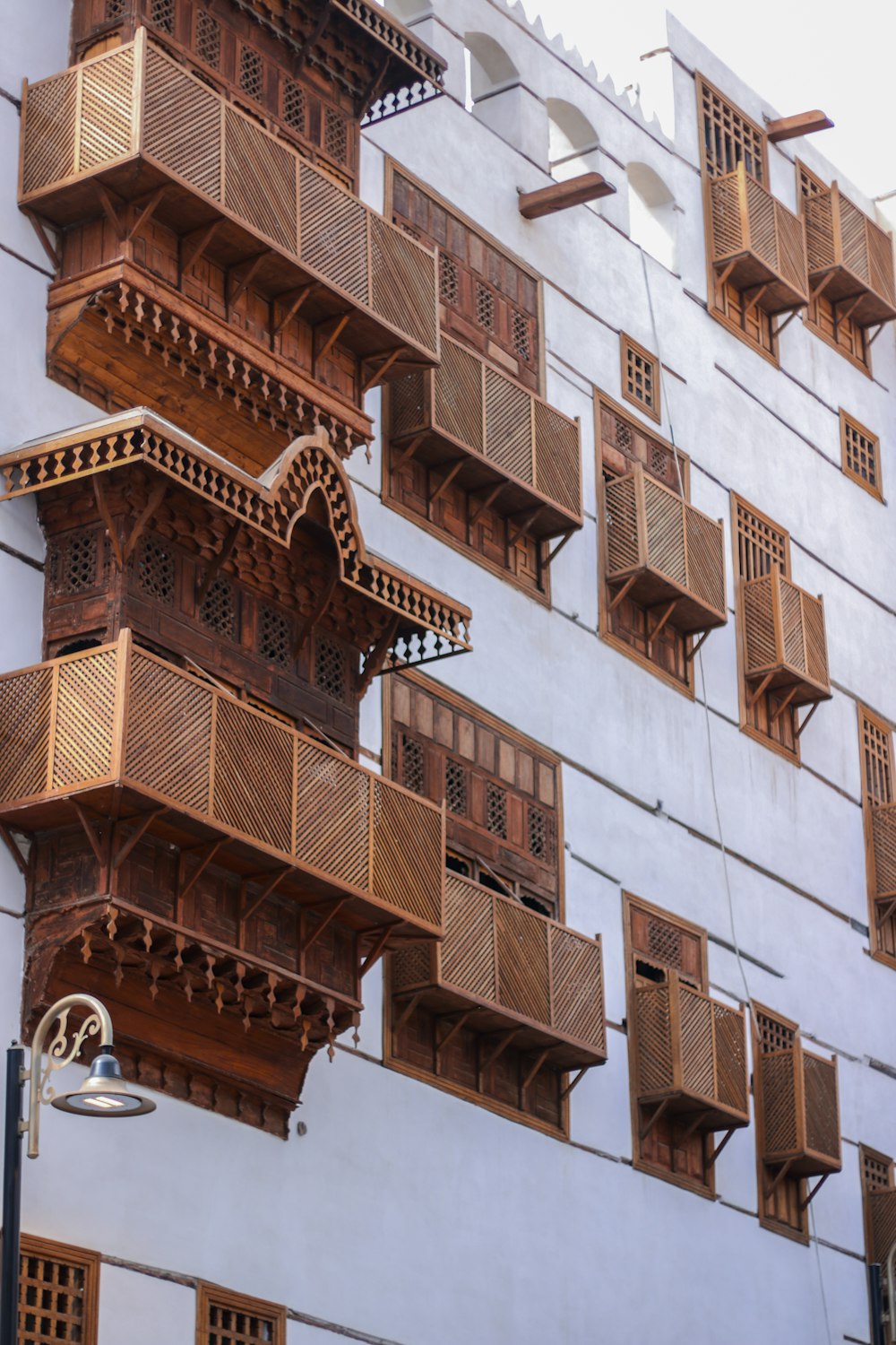 a tall building with lots of balconies on it