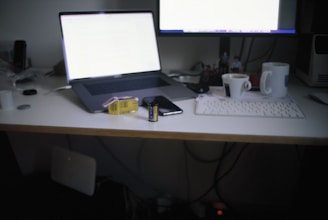 a laptop computer sitting on top of a desk