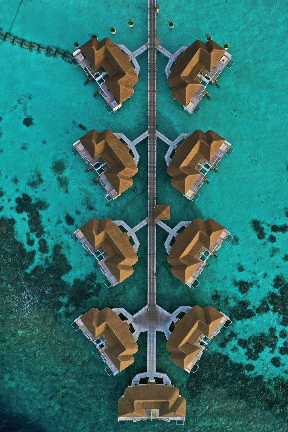 an aerial view of a pier with several buildings on it