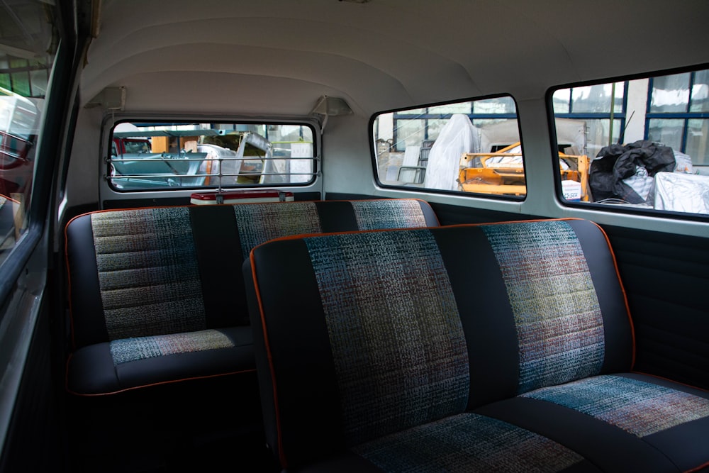 the seats in the bus are empty of people