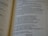 A close-up of an open book with printed text, focusing on several paragraphs organized by numbers and verses. The page appears to be from a religious or spiritual book.