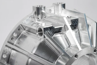 a close up of a metal object on a white surface