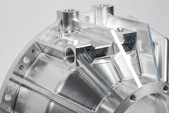 a close up of a metal object on a white surface
