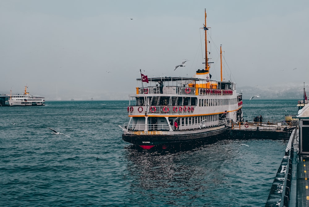 a large boat floating on top of a large body of water